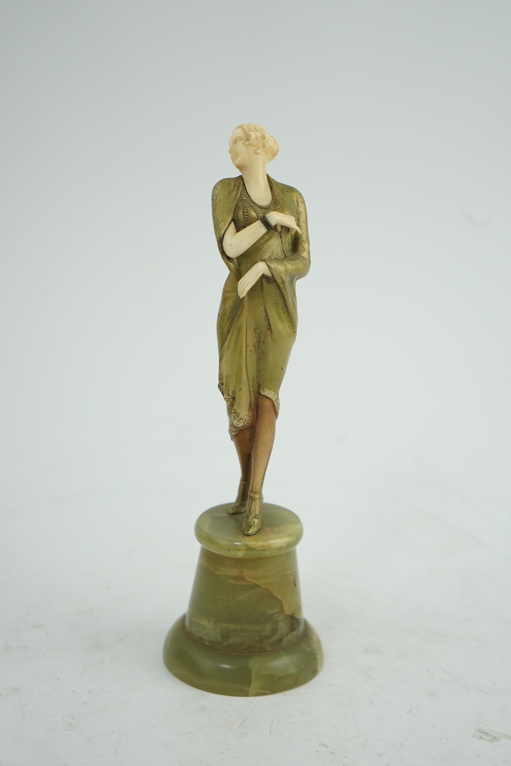 Attributed to Josef Lorenzl. An Art Deco bronze and ivory figure of a stylish lady